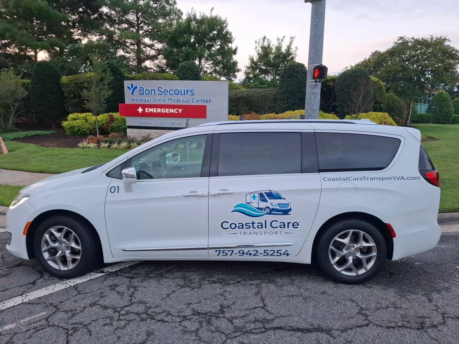 Coastal Care Transport vehicle parked outside Bon Secours Harbour View Medical Center in Suffolk, Virginia